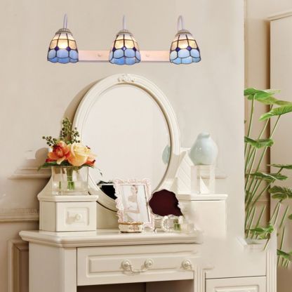 Blue flower metal wall lamps on vanity - Las Sola Lighting