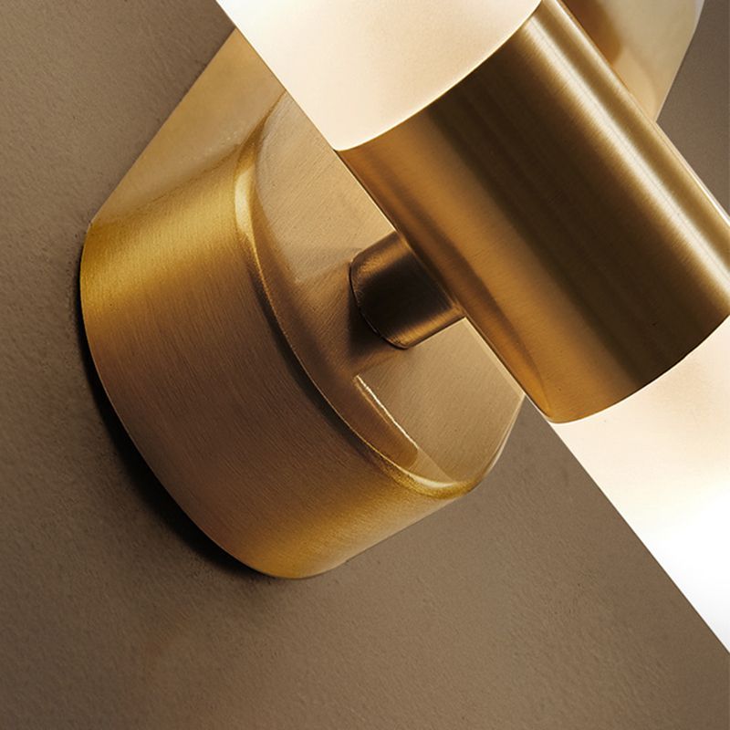 Leigh modern gold cylindrical LED wall lamp, close-up