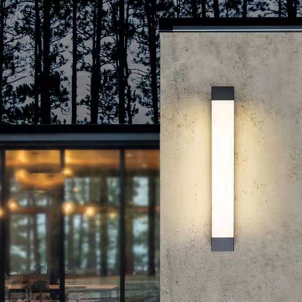 Orr linear outdoor wall lamp on textured wall.