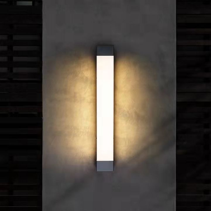 Orr minimalist outdoor light on gray exterior wall.
