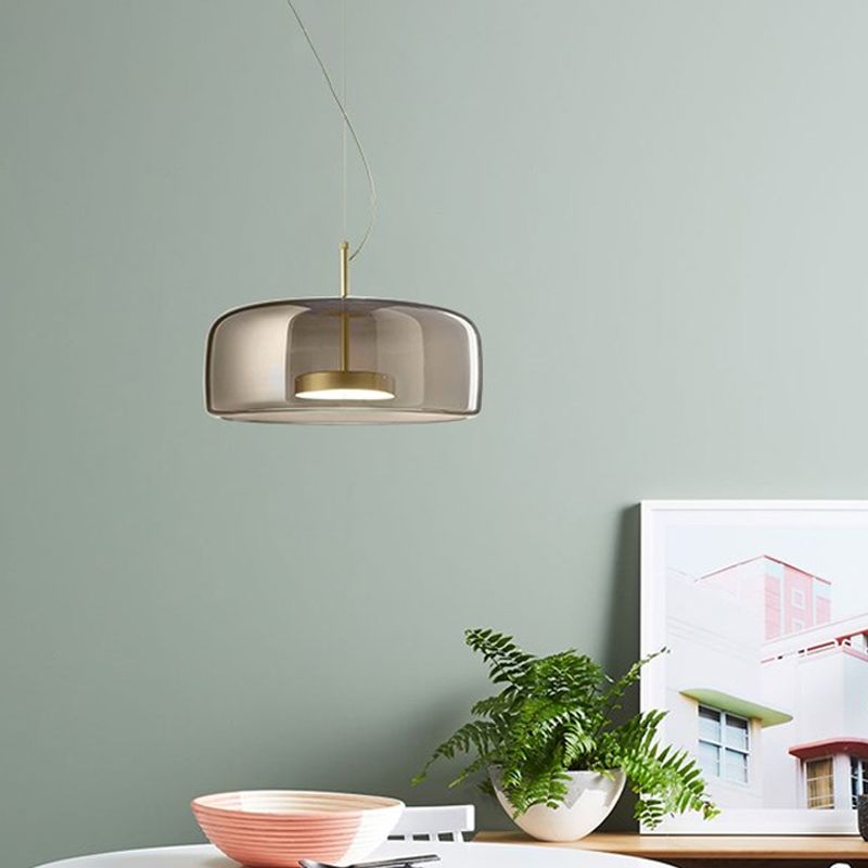 Smoky gray pendant light in minimalist kitchen setting. Minimalist Cylindrical Metal/Glass Pendant Light, Kitchen