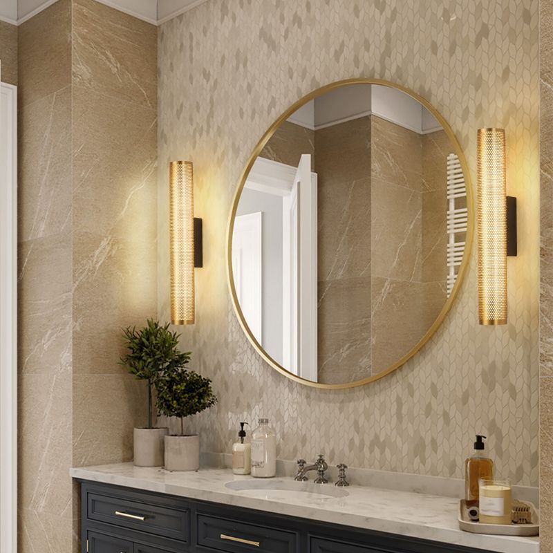 Modern bathroom with Zaid brass wall lamp and gold mirror