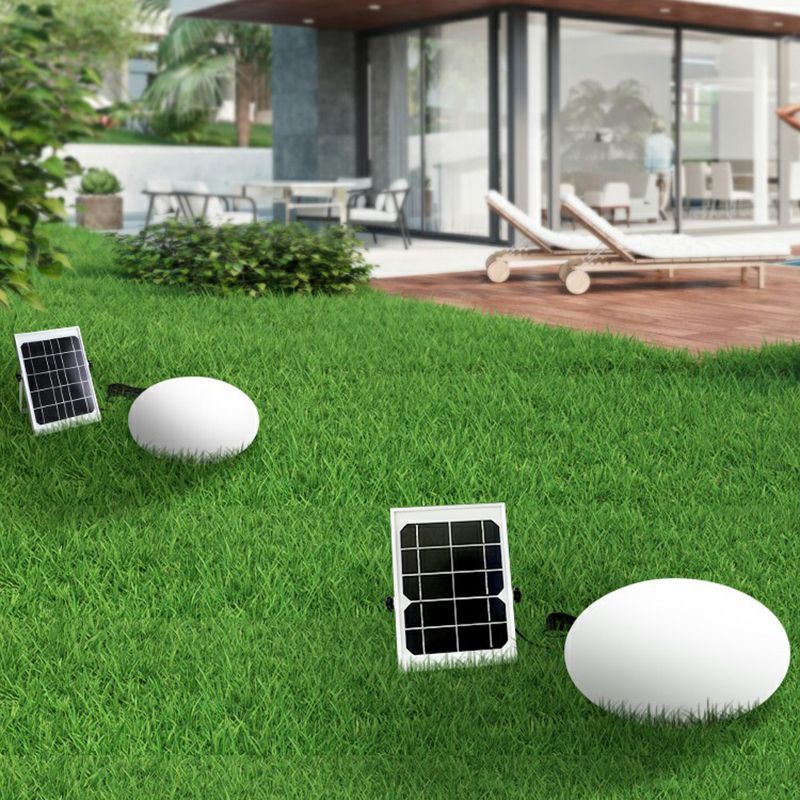 Solar-powered Pena outdoor ground light in a garden