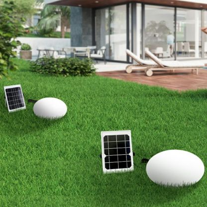Solar-powered Pena outdoor ground light in a garden