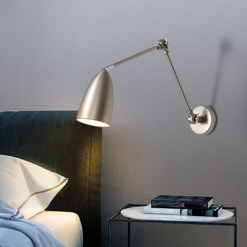 Modern adjustable Brady wall lamp over nightstand in bedroom