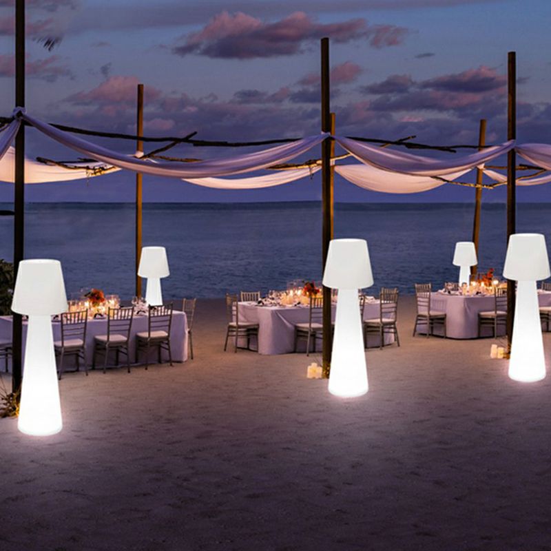 Outdoor dining setup with Pena path lights at dusk