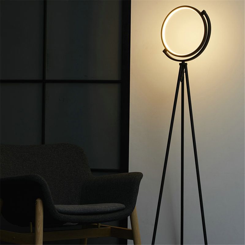 Salgado modern tripod floor lamp illuminates a living room