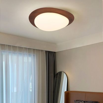 Modern Quinn ceiling light in bedroom, walnut trim