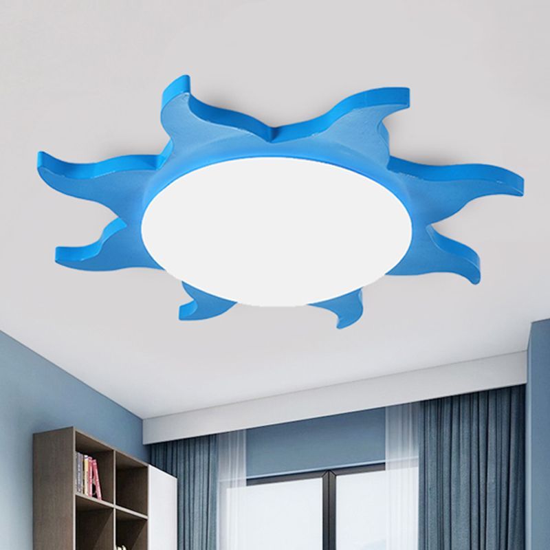 Blue Freja sun-shaped ceiling light fixture in bedroom