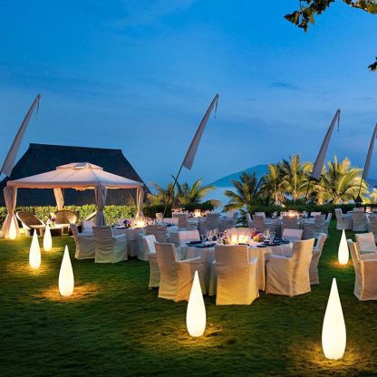 Pena outdoor path lights illuminating a courtyard event at night.