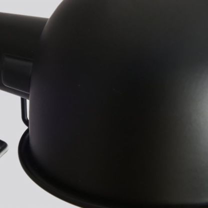 Close-up: Brady black metal dome wall lamp.
