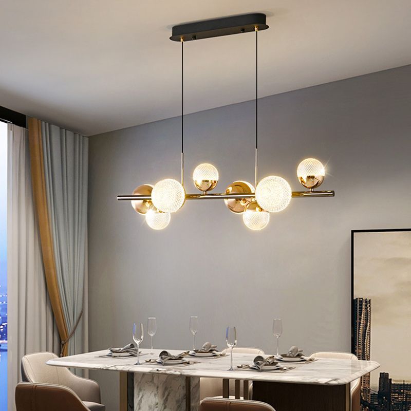Modern bubble glass pendant light over dining table.