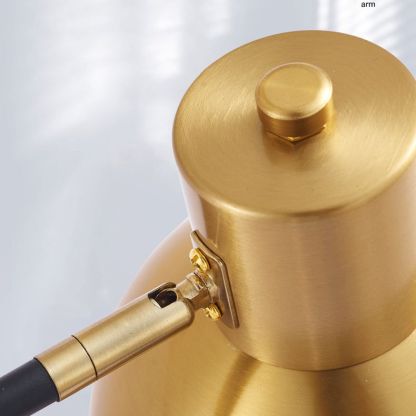 Freja gold wall lamp arm detail, adjustable metal sconce