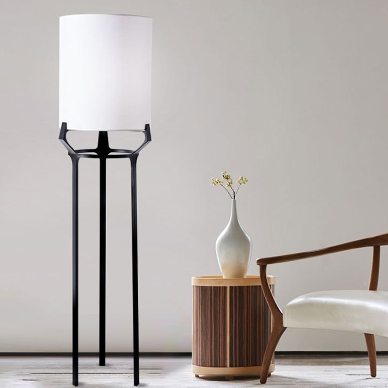 Eryn floor lamp: black tripod with white shade.