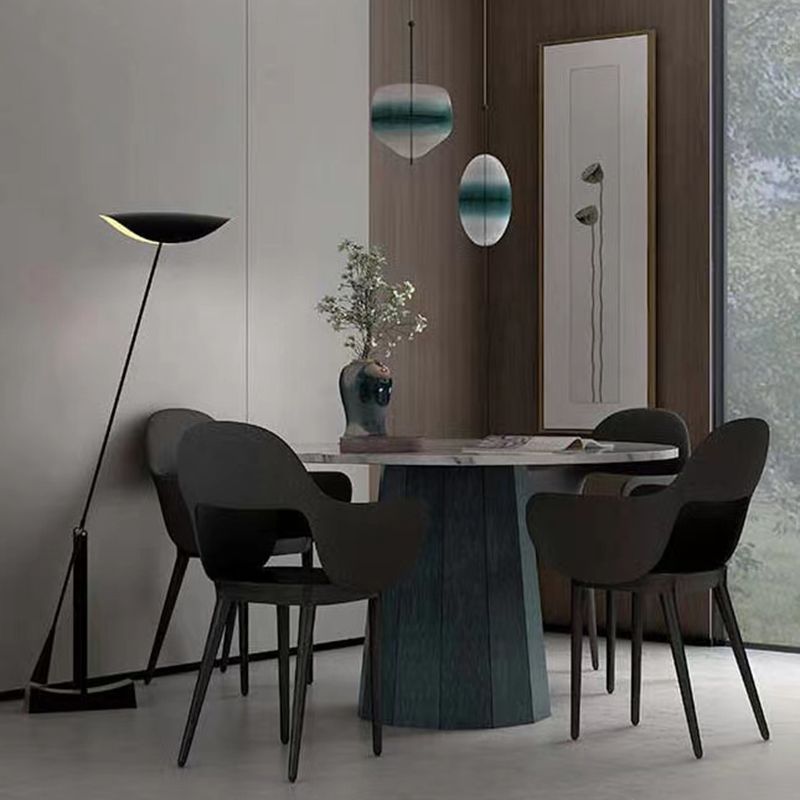 Modern dining room with Carins floor lamp and black chairs