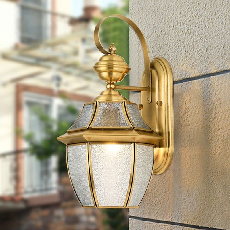 Gold Alessio outdoor wall lamp on textured wall