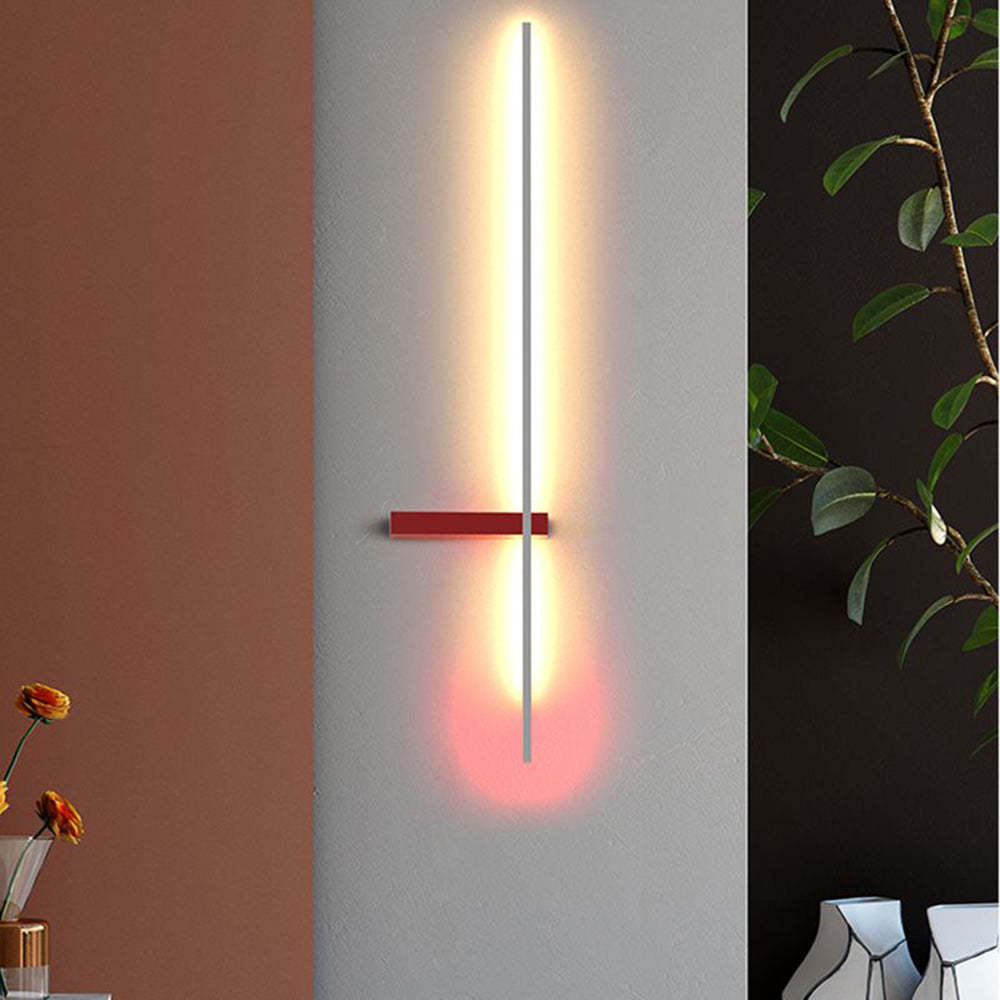 Minimalist linear wall lamp illuminating a modern interior
