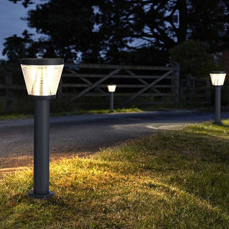 Pena Solar Bollard Lights illuminating a garden pathway at night