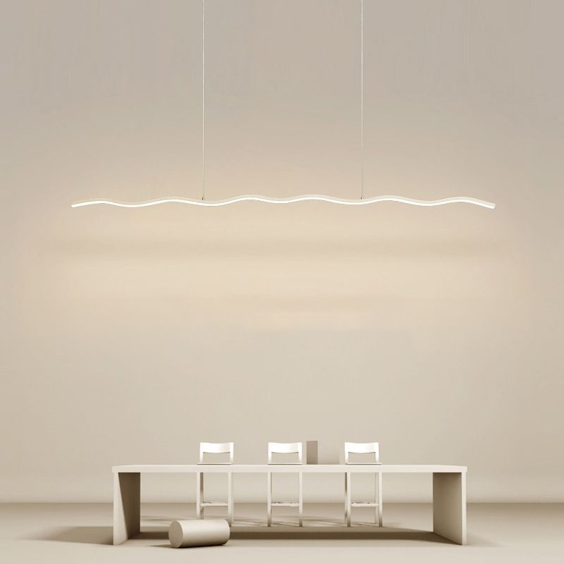 Louise Wave Linear Pendant Light illuminating a dining area