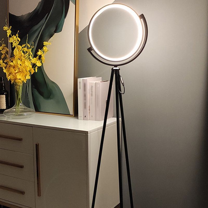 Salgado Tripod Floor Lamp illuminating a modern living space