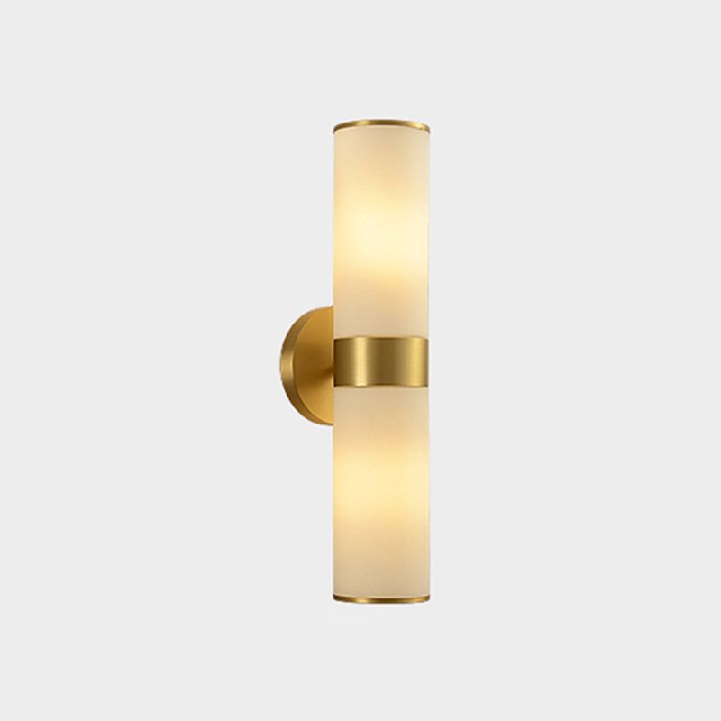 Leigh brass cylinder bedside wall lamp with glass shade