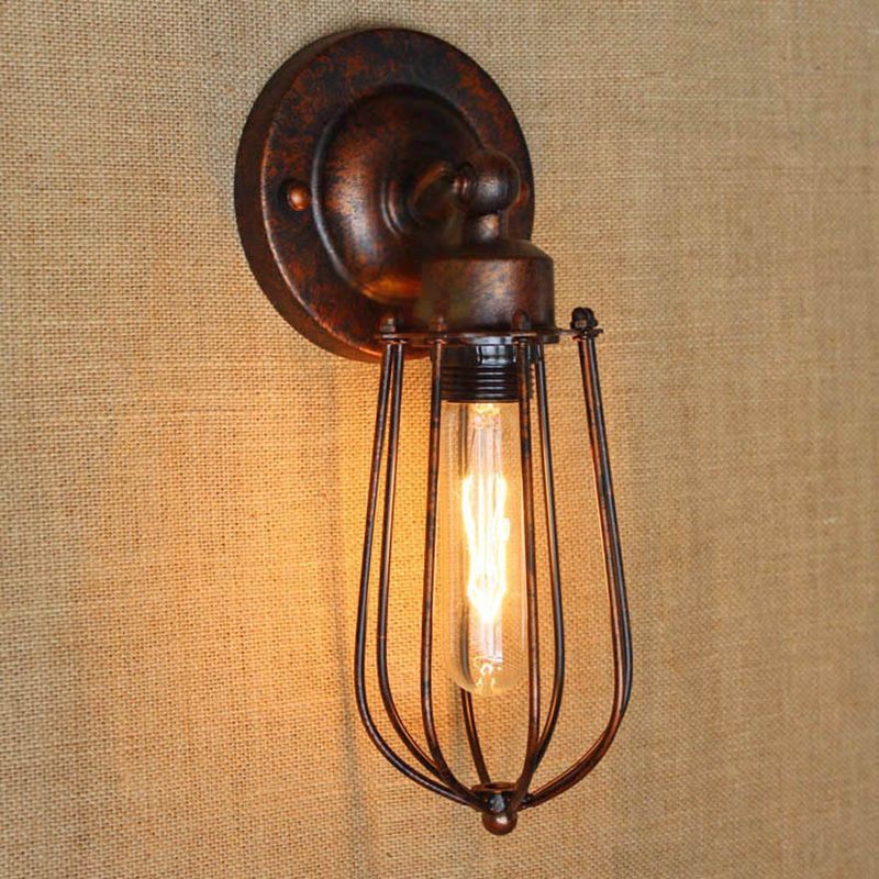 Rustic bronze Alessio wall lamp with iron cage shade.