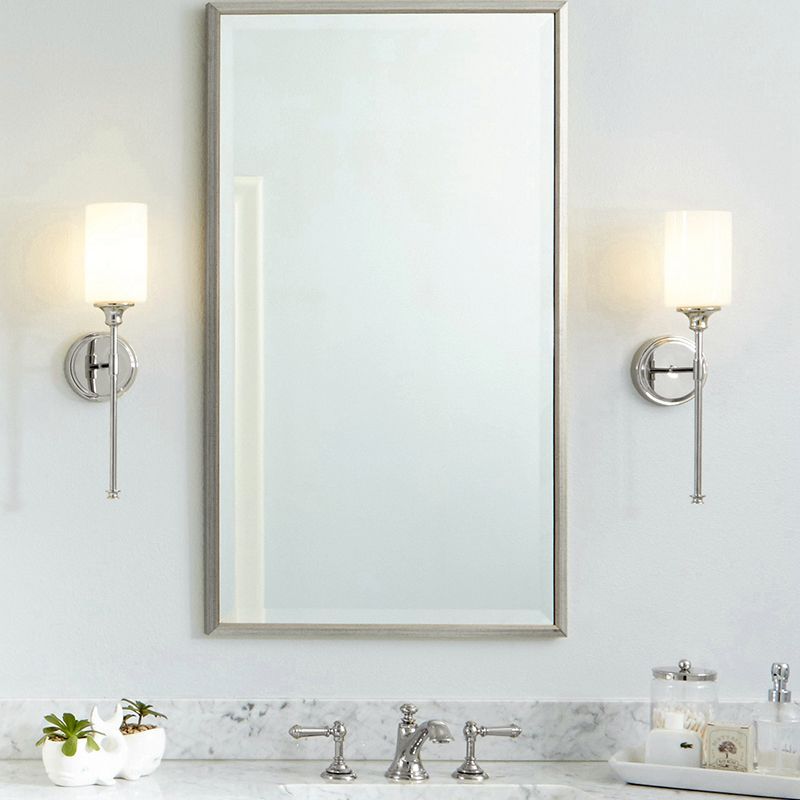 Modern bathroom with Eryn Nordic wall lamps and mirror