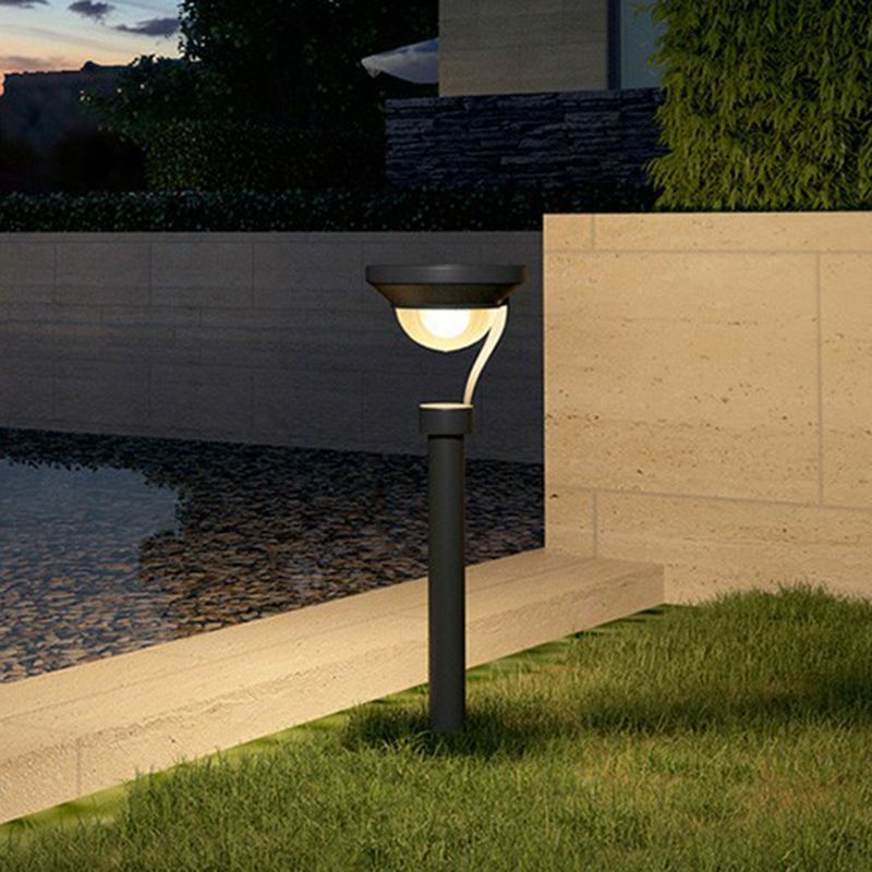 Pena Dark Gray Outdoor Bollard Light illuminating garden