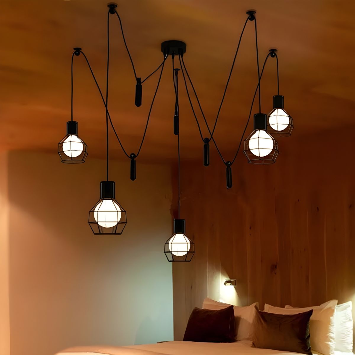 Alessio 5-head caged pendant light in bedroom.