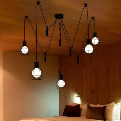 Alessio 5-head caged pendant light in bedroom.