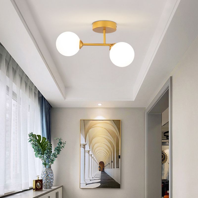 Gold Valentina ceiling light in hallway with decor
