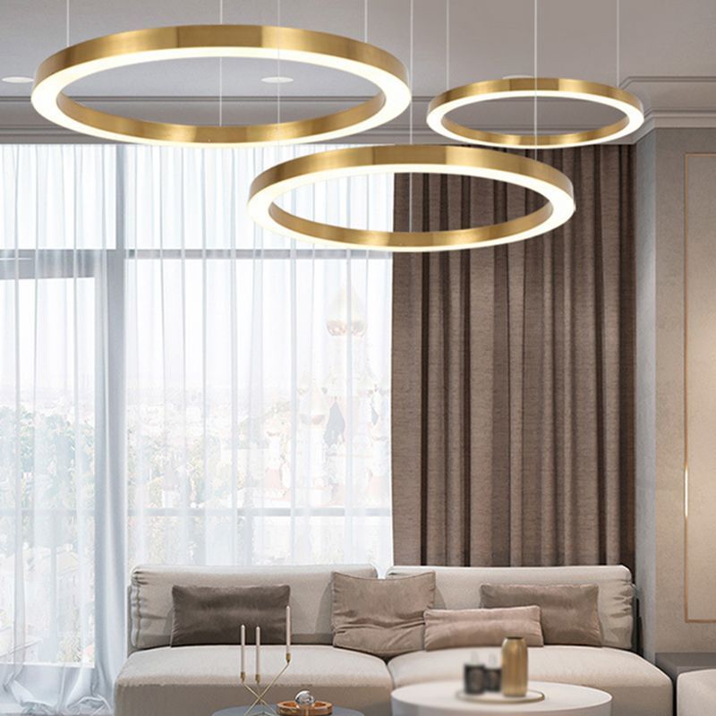 Arisha modern gold ring pendant lights in living room.