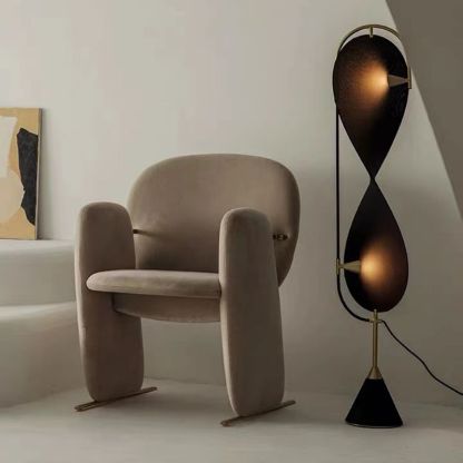 Modern floor lamp and stylish armchair, interior decor