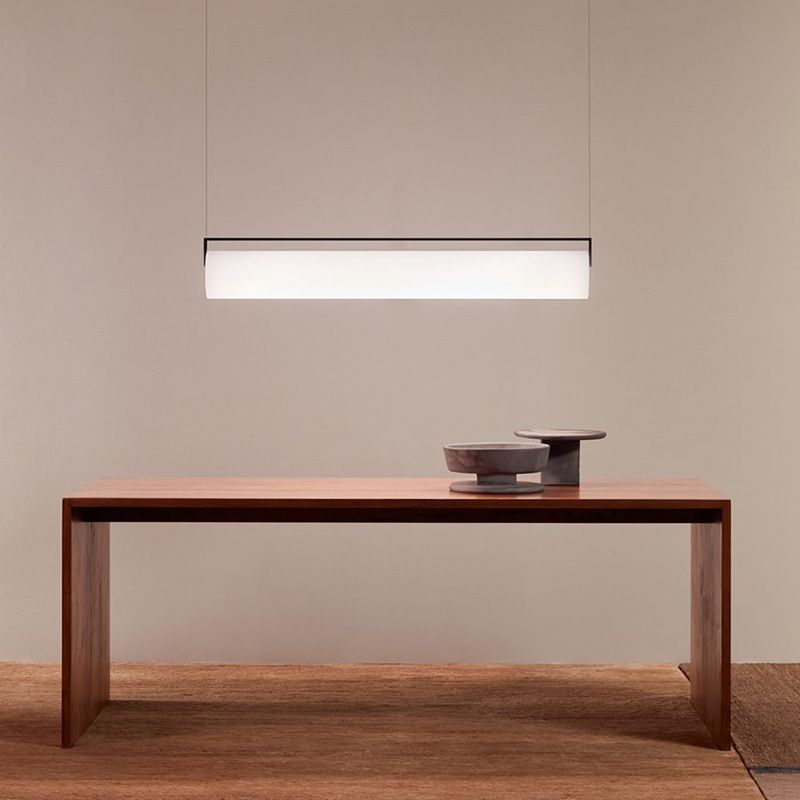 Edge Cylindrical Pendant Light above wood table