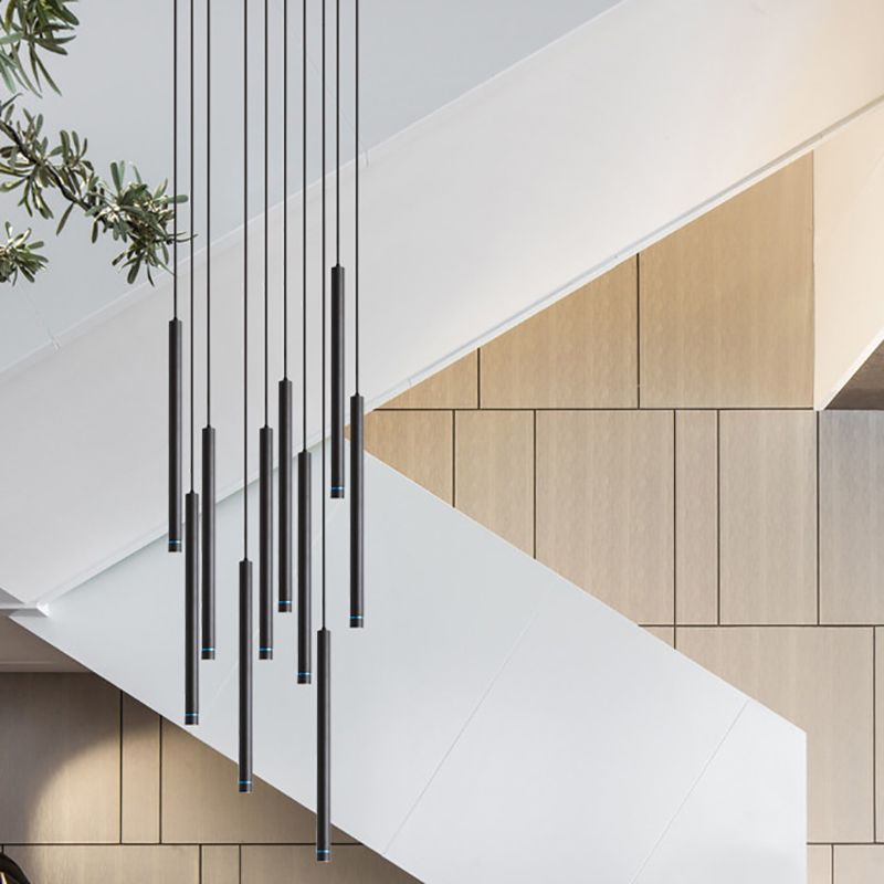 Black Edge Cylinder Pendant Lights near staircase.