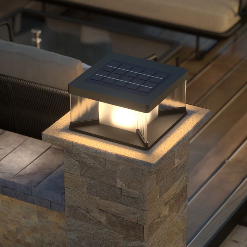Riley LED solar wall lamp on stone pillar