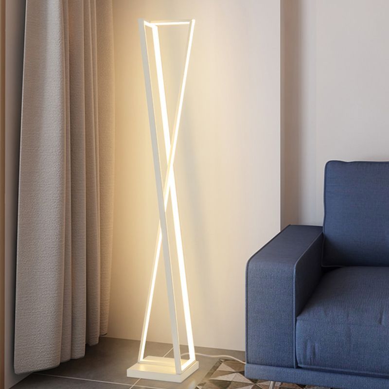 Modern white Edge floor lamp with unique crossed triangle design.
