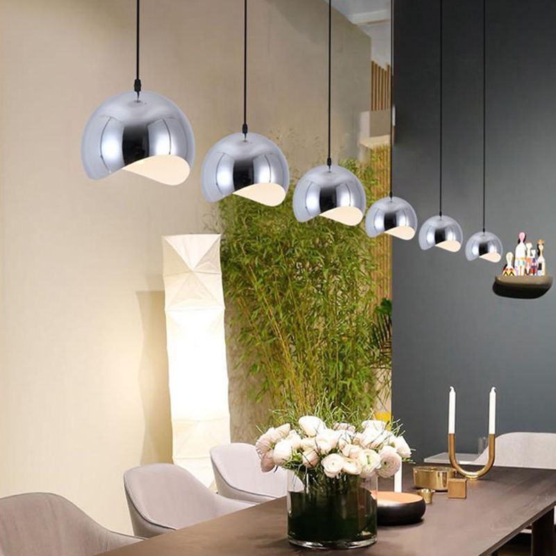 Chrome Cooley Pendant Lights over Dining Table