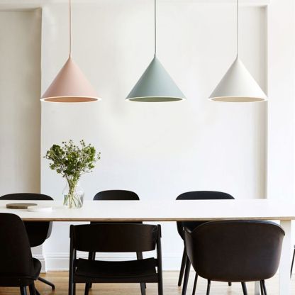 Morandi pendant lights above dining table. Artistic lighting solutions.