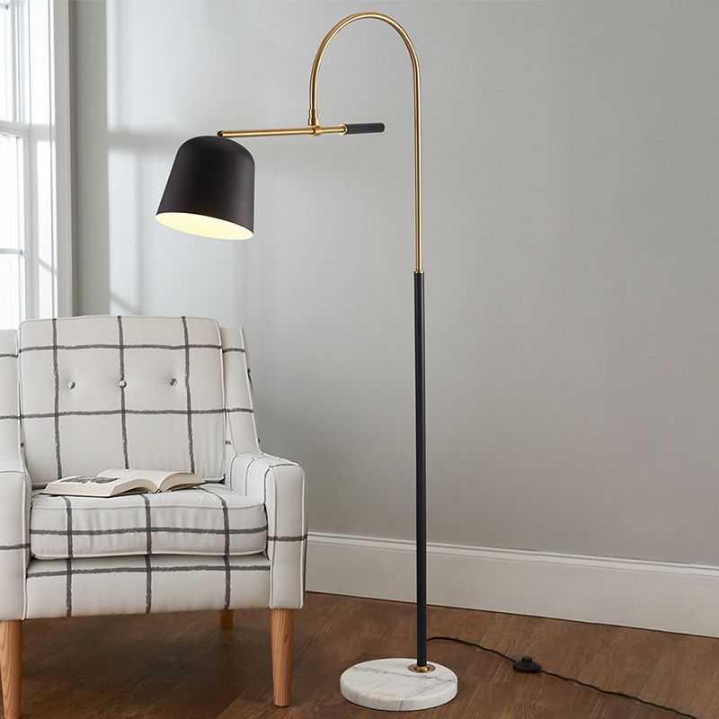 Modern arc floor lamp beside armchair in living room