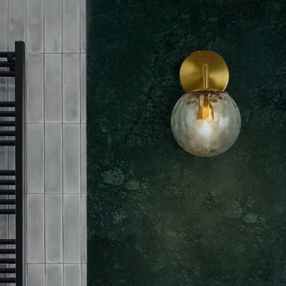 Valentina Bubble Wall Lamp illuminating a bathroom