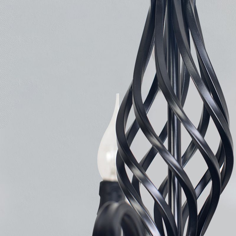 Black metal pendant light detail, candle-shaped bulb