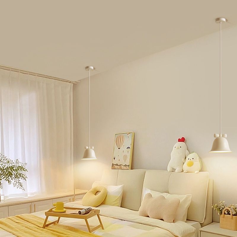 Carins pendant lights in cozy bedroom setting.