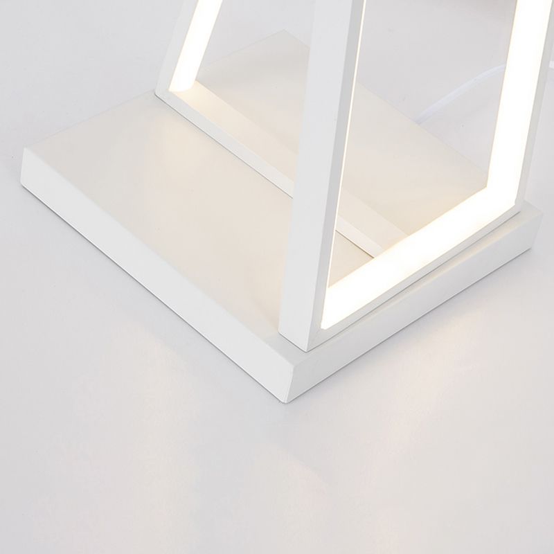 Close-up of white Edge Linear Triangle Floor Lamp base.