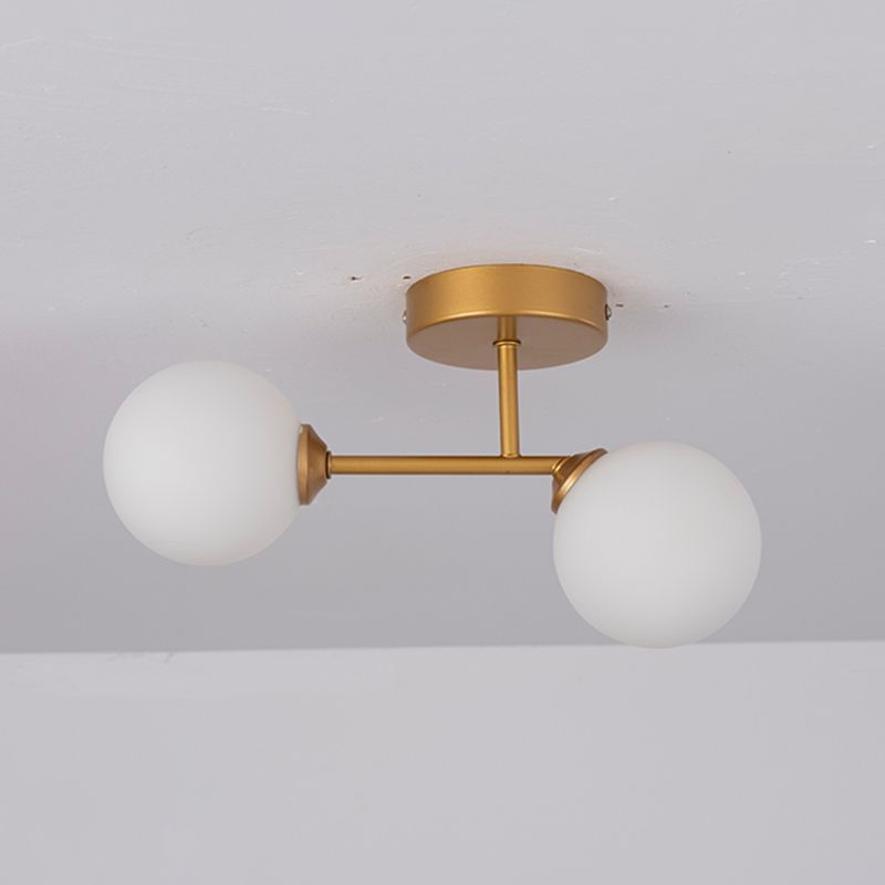 Gold Valentina ceiling light with globe shades