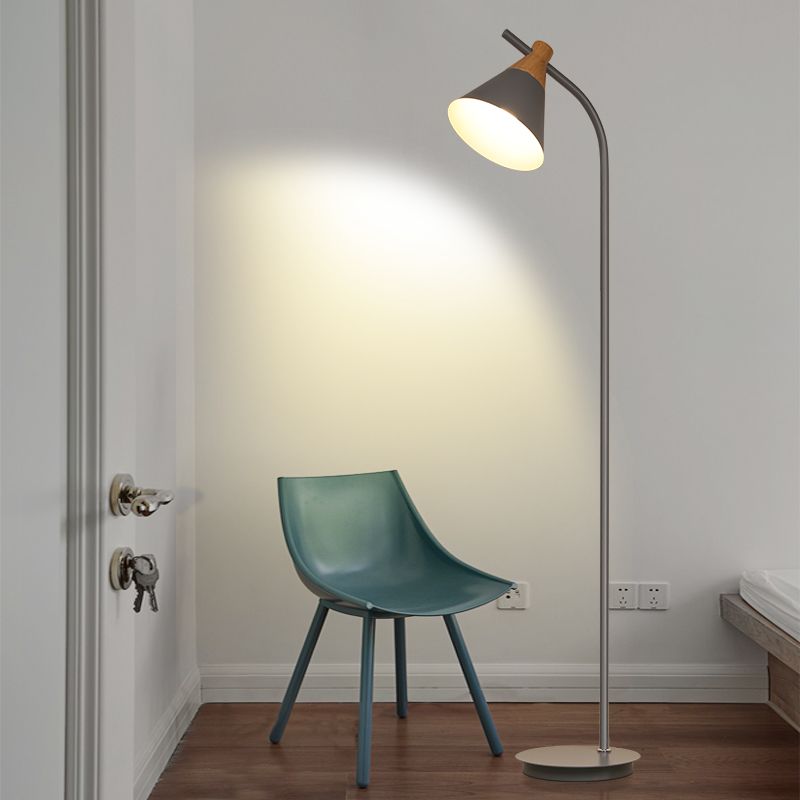Morandi floor lamp with metal shade next to a blue chair