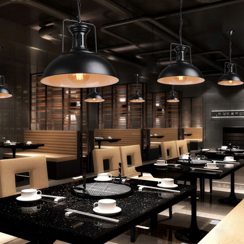 Restaurant lighting with Alessio vintage black pendant lights.
