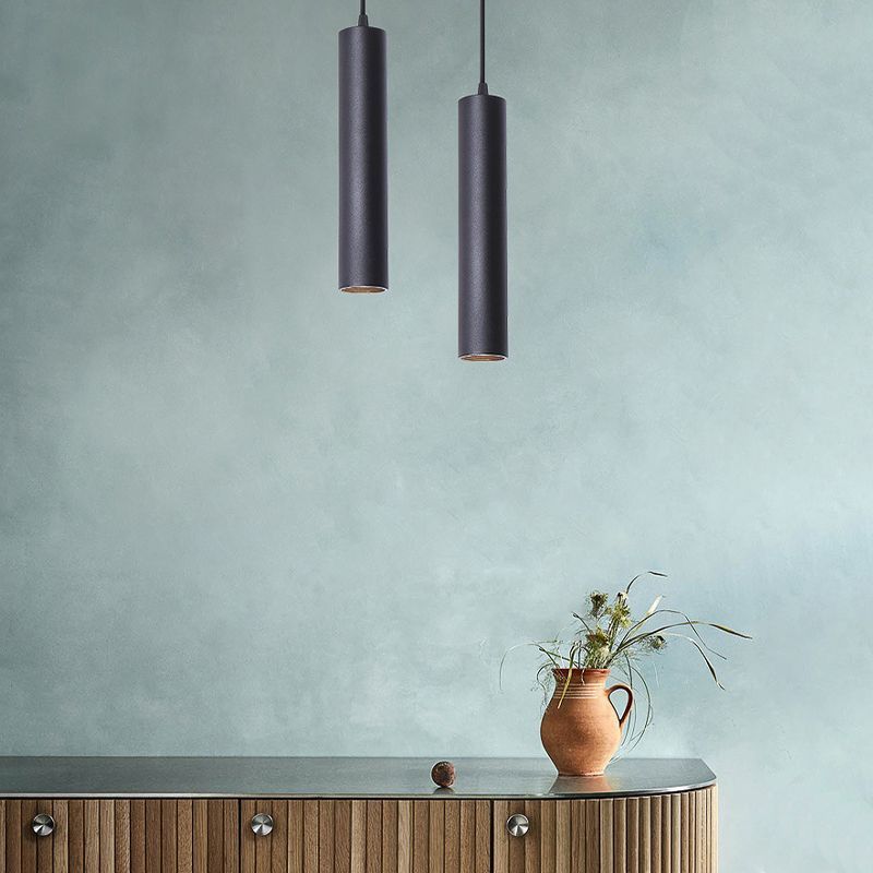 Black Edge cylinder pendant lights in a modern living room