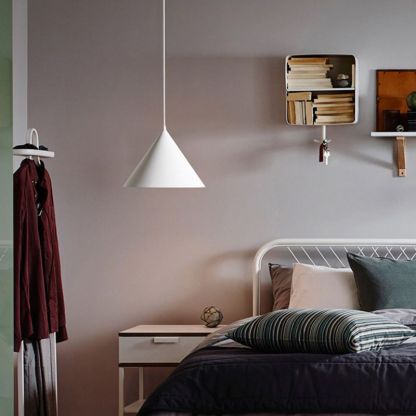 Morandi funnel pendant light in modern bedroom. Artistic lighting solutions.