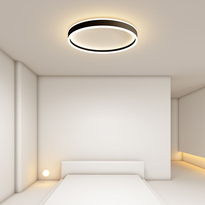 Modern Quinn Round LED Ceiling Light in a Bedroom Setting
